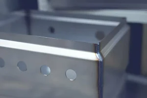 welding-Production of industrial stainless steel cabinets. Curved metal blanks before welding